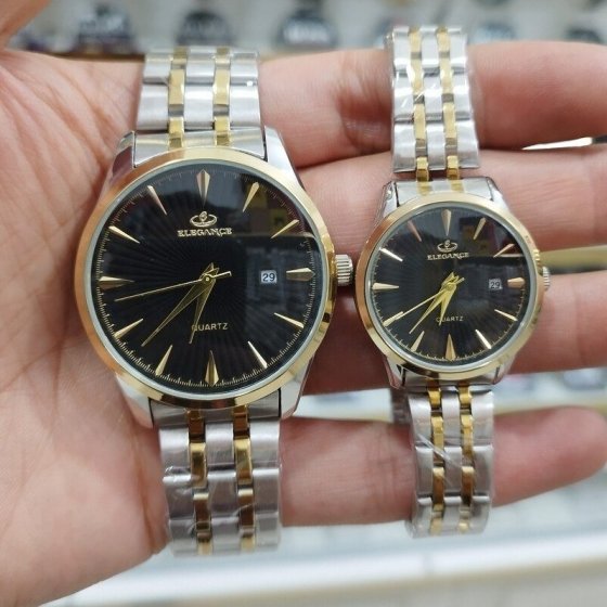 ست ساعت مچی مردانه و زنانه الگانس صفحه مشکی بند دو رنگ+باطری اضافی  کد 2552