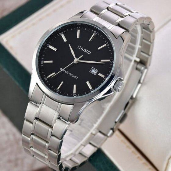 ساعت ست و تکی زنانه و مردانه عقربه ای کاسیو CASIO صفحه گرد مشکی بند استیل نقره ایی+باطری اضافی  - تک  کد2720