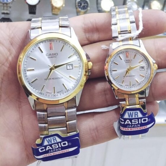ساعت ست و تکی زنانه و مردانه عقربه ای کاسیو CASIO صفحه گرد سفید بند استیل دو  رنگ طلایی نقره ایی +باطری اضافی- تک کد 2727