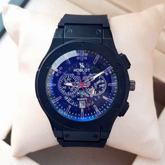 ساعت مچی مردانه (پسرانه) هابلوت Hublot تقویم دار عقره ایی بند سیلیکات مشکی موتور نمایان طرح دو موتوره مشکی عقربه نقره ایی +باطری اضافی کد 2737