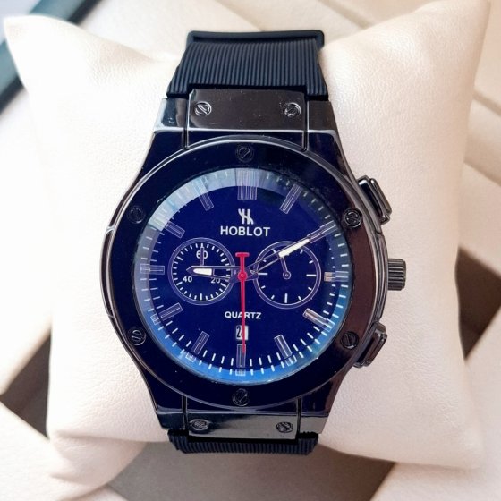 ساعت مچی مردانه (پسرانه) هابلوت Hublot تقویم دار عقره ایی بند سیلیکات مشکی طرح دو موتوره  عقربه نقره ایی+باطری اضافی کد 2740