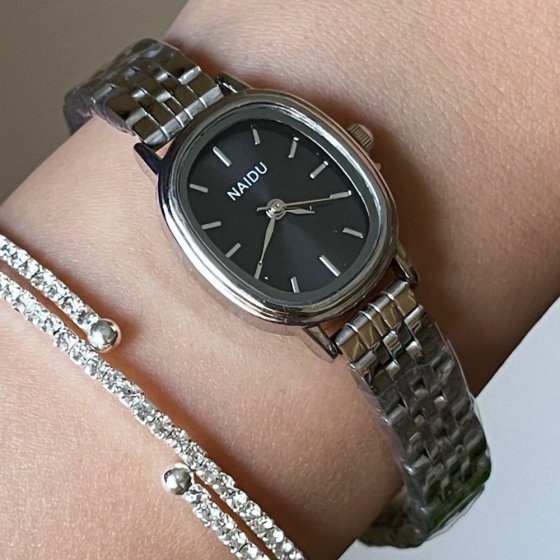 ساعت مچی زنانه نایدو NAIDU مدل صفحه بیضی مشکی بند استیل +باطری اضافی کد 3135