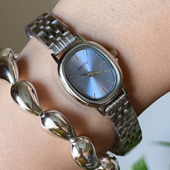 ساعت مچی زنانه نایدو NAIDU مدل صفحه بیضی آبی بند استیل+باطری اضافی کد 3136