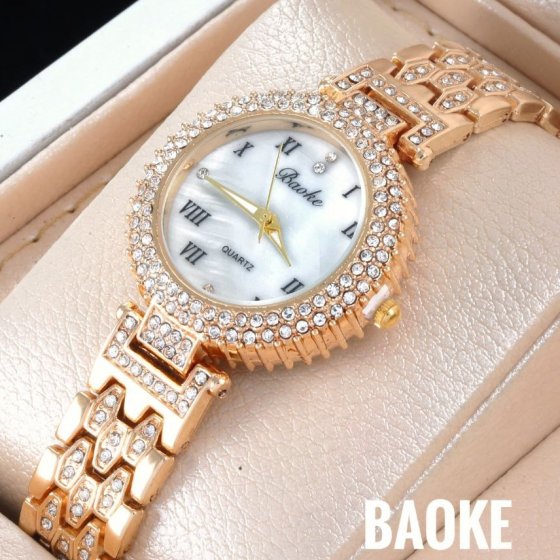 ساعت مچی زنانه BAOKباعوک نگین دار بند استیل نگین دار طلایی  صفحه نمایش گرد سفید شیسه  مجلسی-+باطری اضافی کد9135