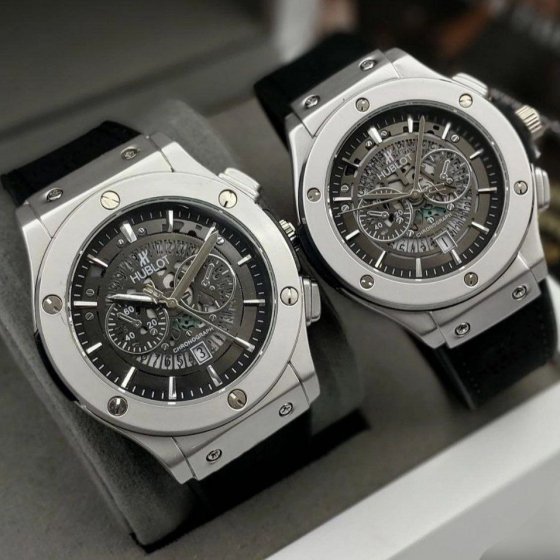 ساعت مچی مردانه هابلوت طرح دو موتور اسکتی بند مشکی قاب طوسی+باطری اضافی کد 9286