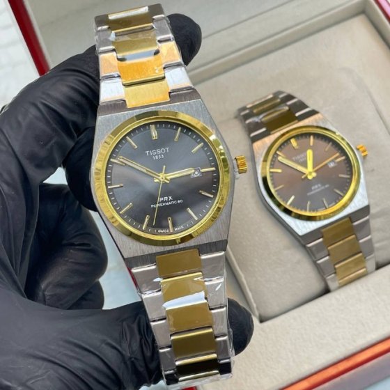 ساعت مچی مردانه تیسوت Tissot بند استیل دو رنگ طلایی و نقره ایی صفحه نمایش مشکی شیک+باطری اضافی کد 9418