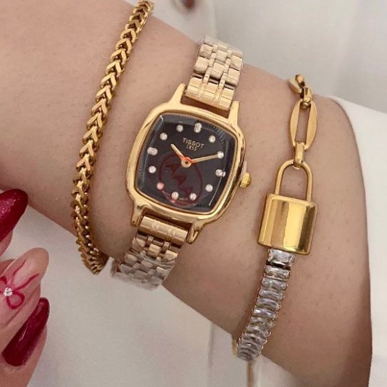 ساعت مچی زنانه تیسوت TISSOTبند استیل طلایی صفحه مربعی مشکی+باطری اضافی کد 9427