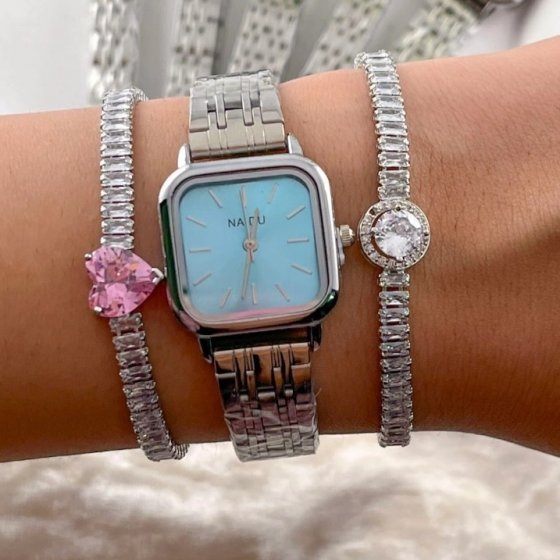 ساعت مچی زنانه نایدو NAIDU بند حصیری استیل نقره ایی مدل صفحه مربعی ابی+باطری اضافی کد 9685