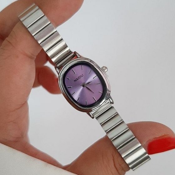 ساعت مچی زنانه نایدو NAIDU صفحه بیضی یونانی بنفش بند ریلی(کرکره ایی ) استیل+باطری اضافی کد 9742