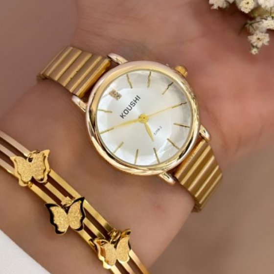 ساعت مچی  زنانه دخترانه کوشی koushi الماسی شیشه تراش دار سفید بند استیل ریلی (کرکره ایی ) طلایی +باطری اضافی کد9934