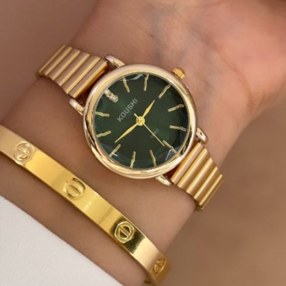 ساعت مچی زنانه دخترانه کوشی koushi الماسی شیشه تراش دار سبز بند استیل ریلی (کرکره ایی ) طلایی +باطری اضافی کد9935